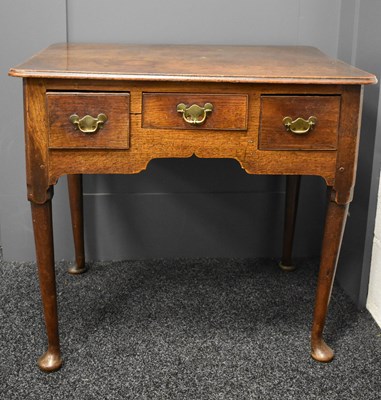 Lot 534 - A 17th century oak lowboy, with three short...