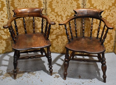 Lot 520 - Two elm Smokers bow chairs with swept scroll...