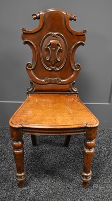 Lot 521 - A Victorian carved hall chair with scrolling...