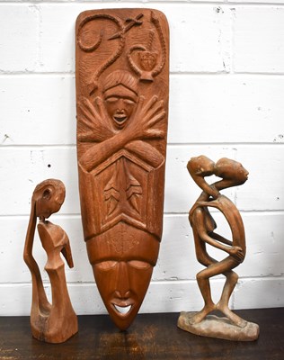 Lot 250 - Three African carvings, to include one wall...