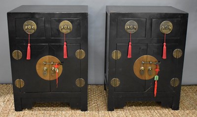 Lot 519 - A pair of Chinese black lacquered cabinets,...