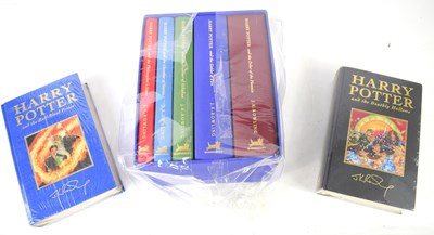 Lot 371 - A set of Harry Potter Deluxe edition books,...