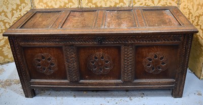 Lot 548 - A 17th century oak coffer with four panel lid...