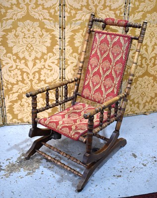 Lot 509 - An early 20th century American rocking chair...