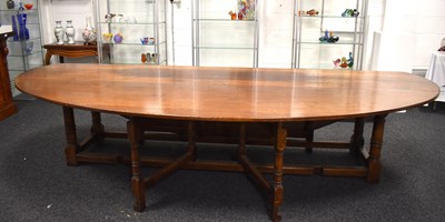 Lot 549 - A large oak drop leaf table in the refectory...