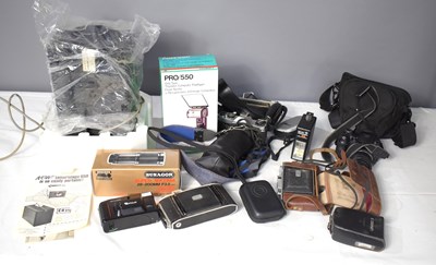 Lot 375 - A group of cameras and accessories to include...