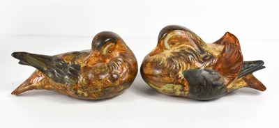 Lot 297 - A pair of pottery ducks, glazed in muted tones,...