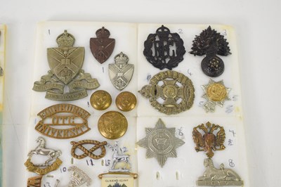 Lot 37 - A group of cap and collar badges, including a...