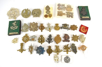 Lot 39 - A group of regimental cap and collar badges...
