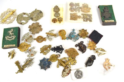Lot 39 - A group of regimental cap and collar badges...
