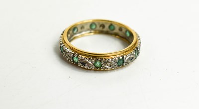 Lot 67 - A 9ct gold, diamond and emerald eternity ring,...