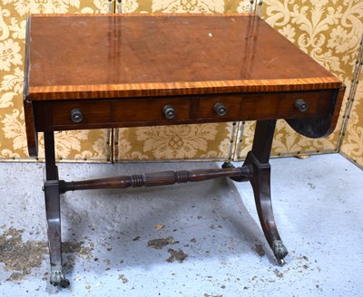 Lot 511 - A Edwardian mahogany drop leaf sofa table, the...