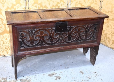 Lot 542 - A 17th century oak coffer, the three panel lid...