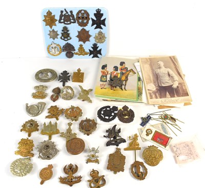 Lot 54 - A group of military cap badges including The...