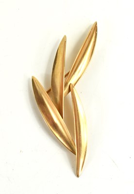 Lot 109 - A 14k gold brooch in the form of four leaves,...