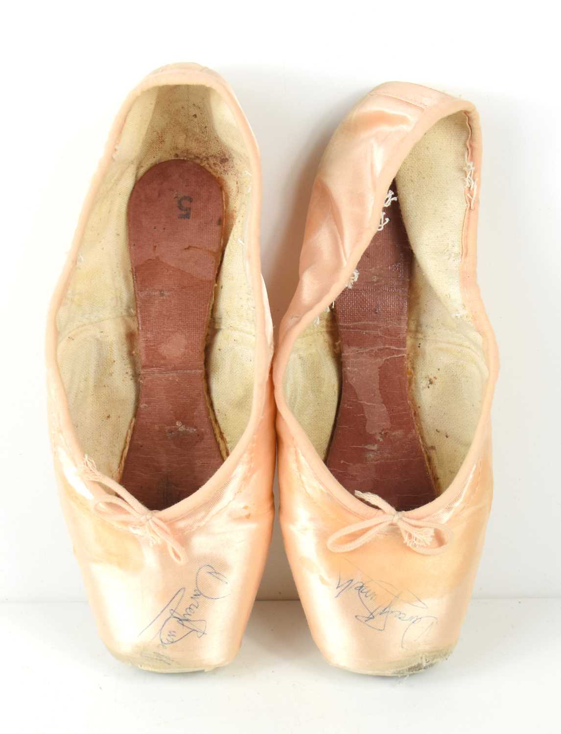 Lot 245 - A pair of ballet pointe shoes both signed by...