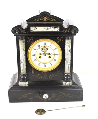 Lot 445 - A French slate and marble mantle clock, carved...