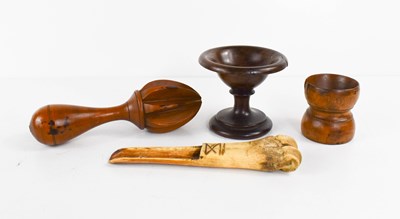 Lot 21 - A 19th century treen lemon squeezer, and a...