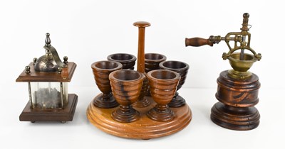 Lot 40 - A 19th century treen eggcup stand, with six...
