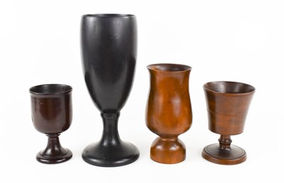Lot 43 - A group of four treen goblets, to include a...