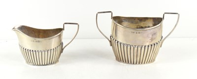 Lot 365 - A silver cream jug and sugar bowl, hallmarked...