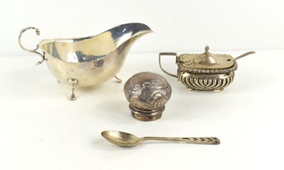 Lot 366 - A group of silver to include a sauce boat,...