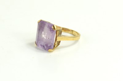 Lot 85 - A 9ct gold and amethyst dress ring, the...