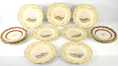 Lot 140 - A group of seven handpainted plates decorated...