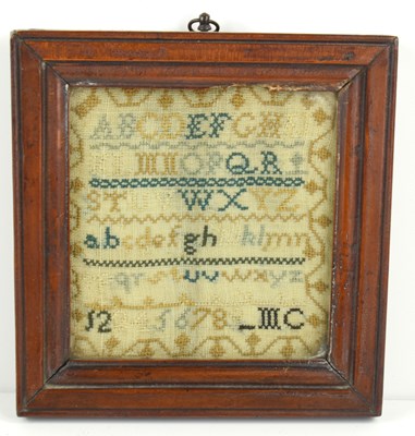 Lot 249 - A small Georgian sampler, cross stitch onto a...