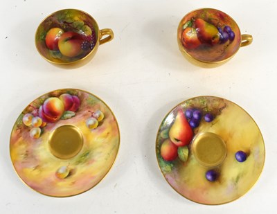 Lot 142 - A pair of Royal Worcester cups and saucers...