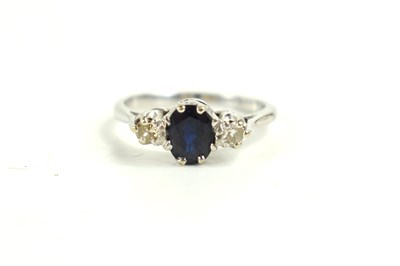 Lot 116 - An 18ct white gold, sapphire and diamond three...