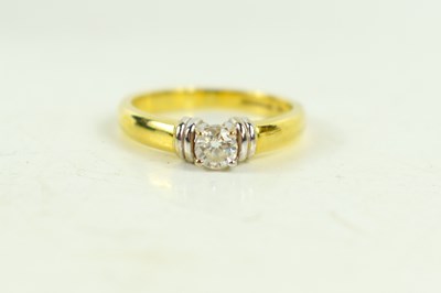 Lot 142 - An 18ct gold and diamond solitaire ring, the...