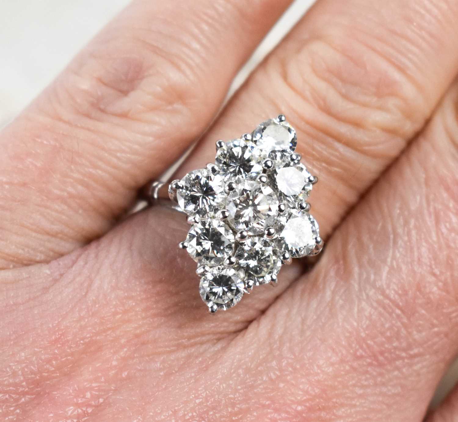 Lot 12 - A diamond dress ring, set with nine brilliant...