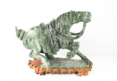 Lot 144 - A large Chinese carved soapstone horse on...