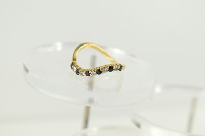 Lot 260 - An 18ct gold, diamond and sapphire eleven...