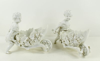 Lot 150 - A pair of blanc de chine putti figurines,...