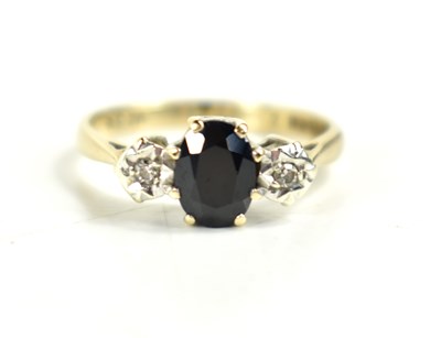 Lot 134 - A 9ct gold, sapphire and diamond ring, the...