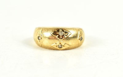 Lot 89 - A gold and diamond gypsy ring, the four...