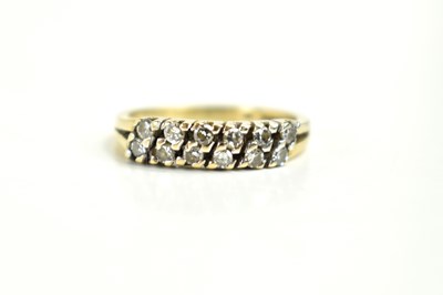 Lot 117 - A 9ct gold and diamond twelve stone ring, the...