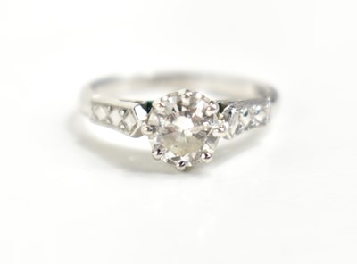 Lot 11 - A platinum and diamond solitaire ring, the...