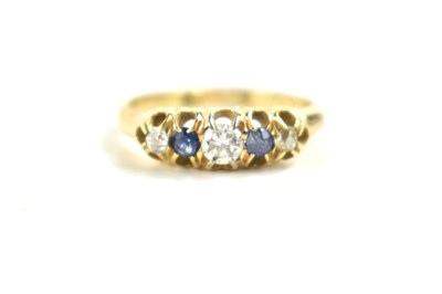 Lot 124 - An 18ct gold, diamond and sapphire five stone...