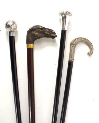 Lot 239 - A group of vintage walking canes, two having...