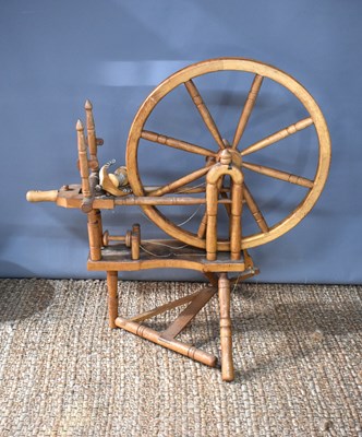 Lot 293 - An antique pine spinning wheel, 100cm.