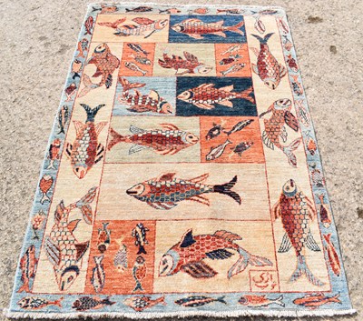 Lot 261 - An Afghan wool rug, depicting various fishes...