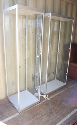 Lot 560 - Two modern glass display cabinets, with...