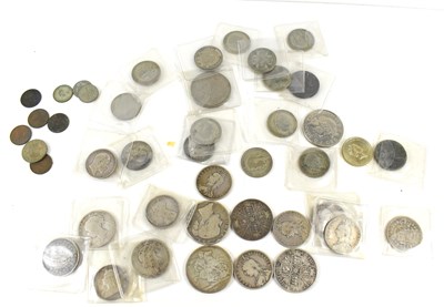 Lot 302 - A collection of coins to include silver...