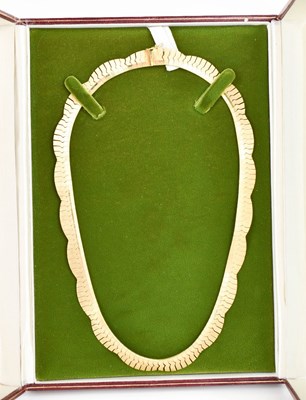 Lot 13 - An 18ct gold necklace, composed of undulating...