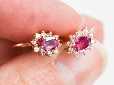 Lot 21 - A pair of 9ct gold, pink sapphire and diamond...