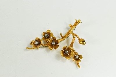 Lot 2 - An 18ct gold and diamond set branch & blossom...