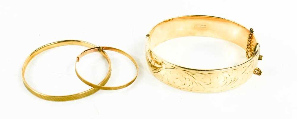 Lot 24 - A 9ct gold baby bangle, a 9ct gold children's...